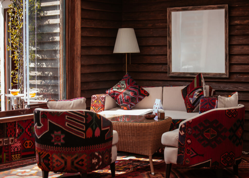 Warm modern Nigerian living room with custom teak wood furniture and modular seating.