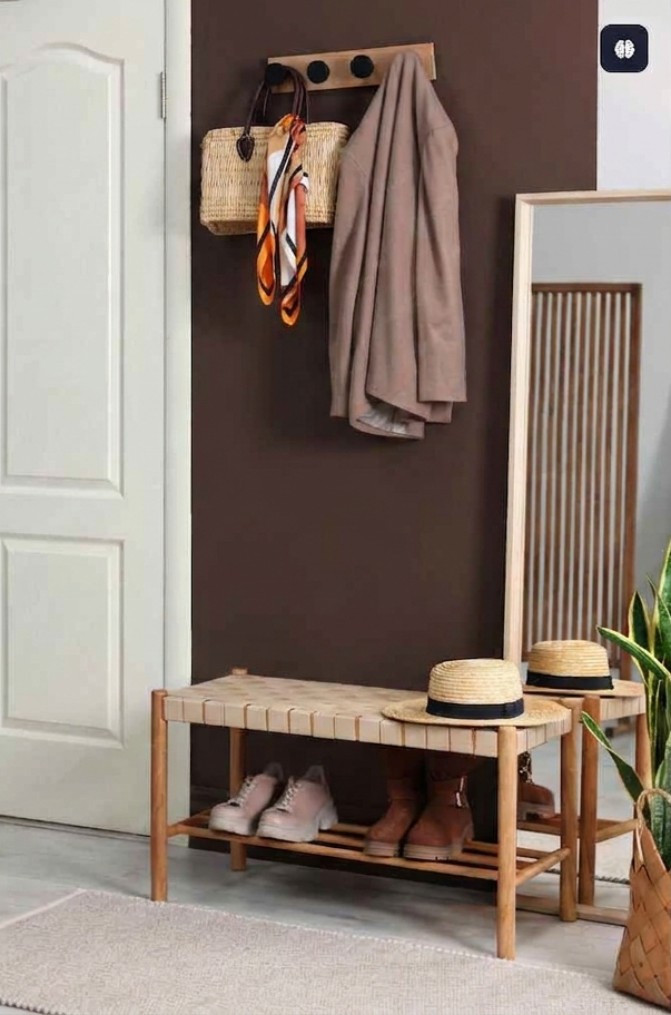 Handcrafted wooden entryway console table with shoe storage and coat hooks.