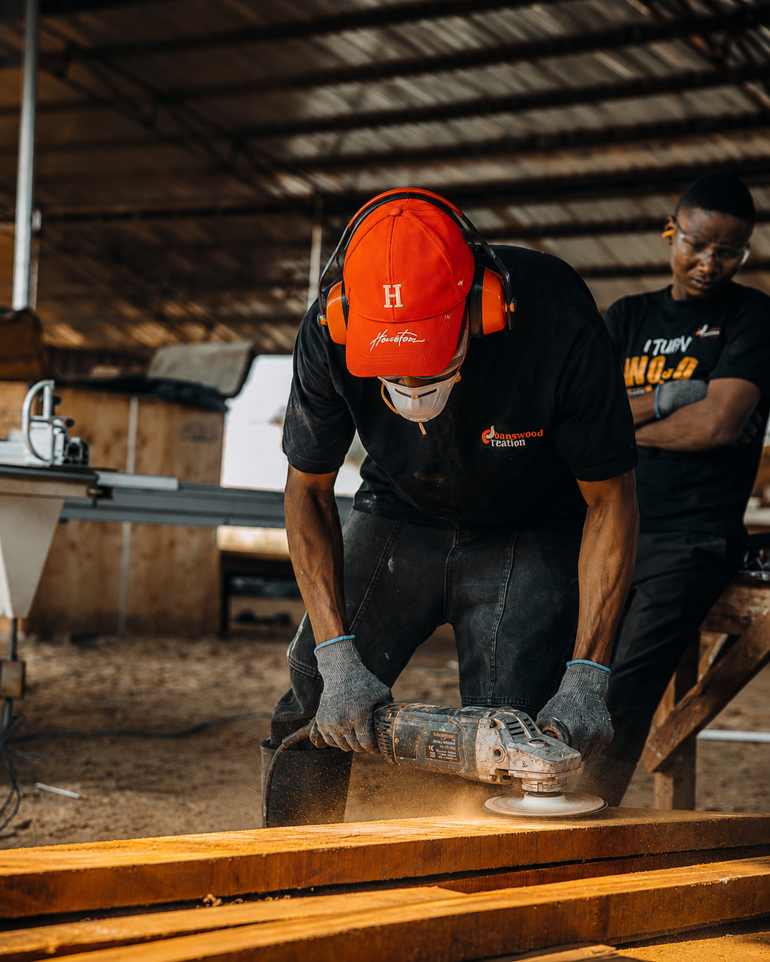 Joanswood Creation team operating machinery in the rebuilt joinery workshop.